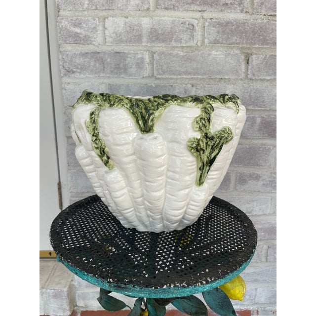 Fabulous and fun painted ceramic cachepot in the shape of white carrots bunched together. Glazed in a tasteful green and...
