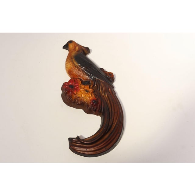 Circa 1920s American painted chalkware bird/pheasant in vibrant red, orange, black, and brown palette. These figurines...