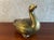 Vintage Mid 20th Century brass goose or duck made of thick, hollow brass that has been lacquered to prevent tarnishing....