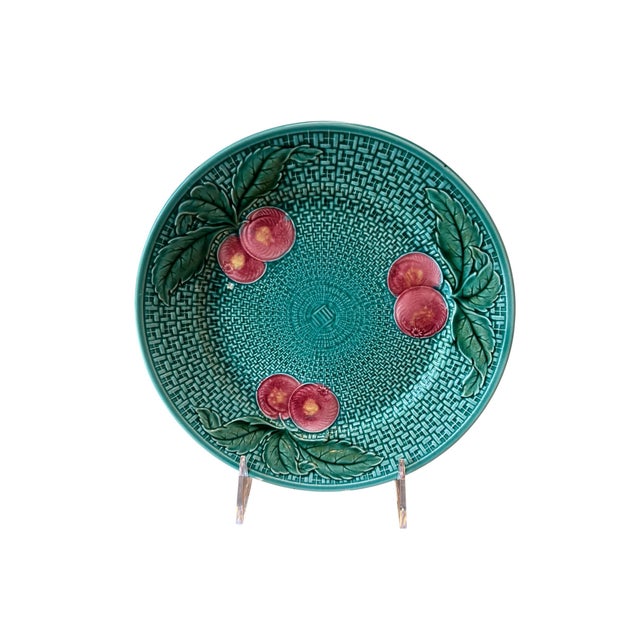 Add a cheerful touch of vintage charm to your home with this beautiful German majolica plate, featuring three clusters of...