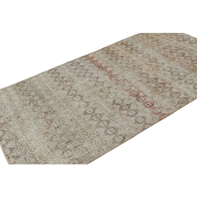 Hand Knotted in wool, this 5x9 vintage Zeki Múren rug originates from Turkey circa 1960-1970, and features a unique play...