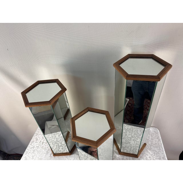 Awesome set of 3 Hexagonal 1979’s Mirrored Pedestal Stands with Oak trim. 3 Different heights for a great display as...