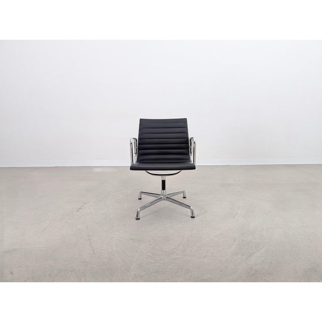 We are offering a beautiful Vitra EA 108 chair with black leather upholstery for sale. Designed by Charles and Ray Eames,...