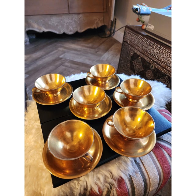 Set of six gold washed antique Do Ca Kunst Remal Bavaria demitasse cups and saucers.