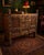 A striking and highly decorative handmade Indian wooden cabinet, distinguished by intricate carving, pierced geometric...