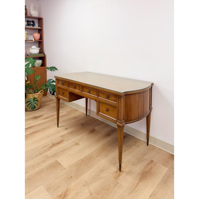 This handsome vintage American of Martinsville mid-century modern transitional desk is a well-made and collectible home...