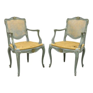 Antique French Louis XV Style Blue Painted Cane Back Fauteuil Arm Chairs - Pair For Sale