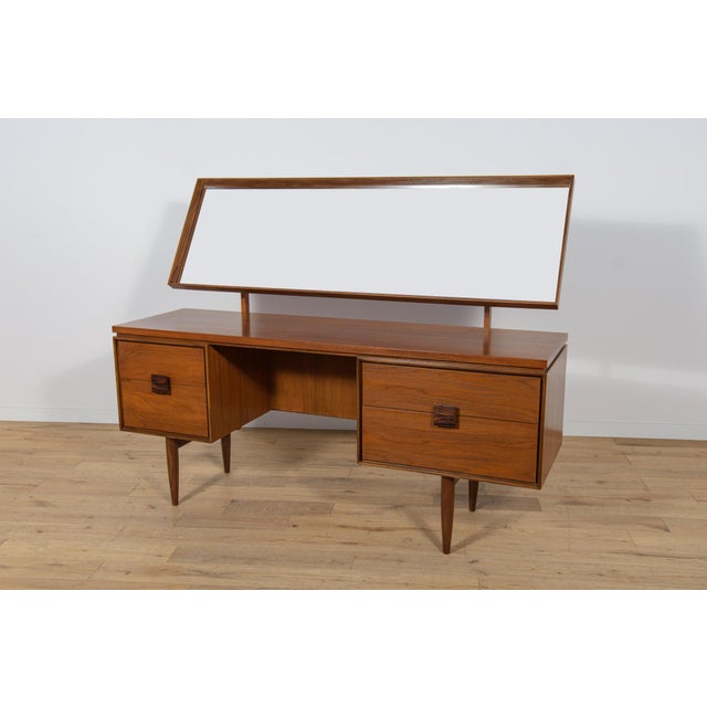 This elegant Scandinavian influenced dressing table designed by I. Kofod-Larsen for G-Plan. The dressing table has four...