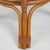 This charming 20th-century French coffee table showcases a sophisticated blend of natural bamboo and sleek glass. The...