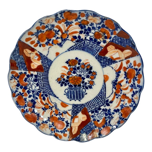 Antique Hand Painted Imari Plate With Scalloped Edges and Vibrant Floral Pattern From Japan - Circa 1900 For Sale