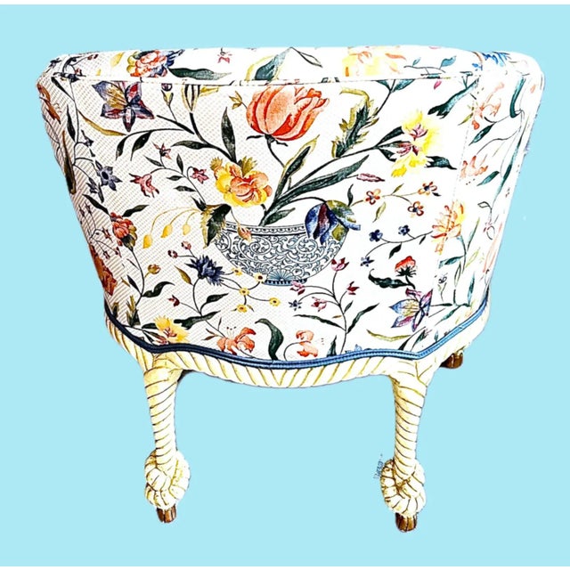 An Italian carved wood tassel rope upholstered armchair, circa mid to late-20th century, Italy. Chair is in the style of...