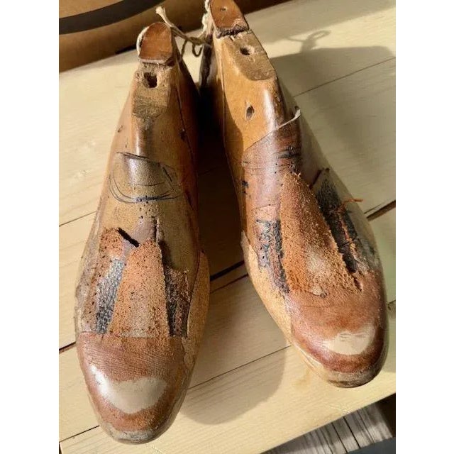 A rare find — a pair of 1920s wood shoe molds with the beginnings of a shoe, leather pieces applied. European size 42....