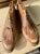 A rare find — a pair of 1920s wood shoe molds with the beginnings of a shoe, leather pieces applied. European size 42....