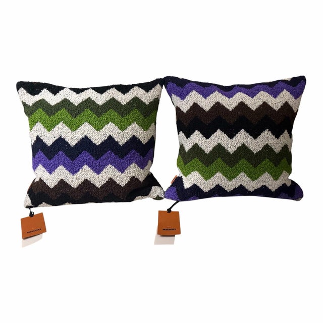 A coordinated three-piece set from Missoni Home’s Riccio collection, including two square accent pillows and one cube pouf...
