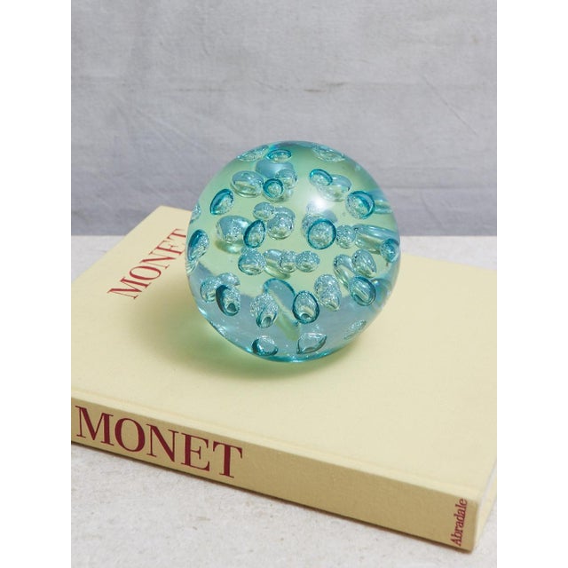 This gorgeous aqua controlled bubble blown glass paperweight has an incredible weight and scale to it. It measures 5.5...