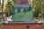 Figurative “Buttercup Lined Path" Contemporary Plein Air Acrylic Painting by Stephen Remick For Sale - Image 3 of 9