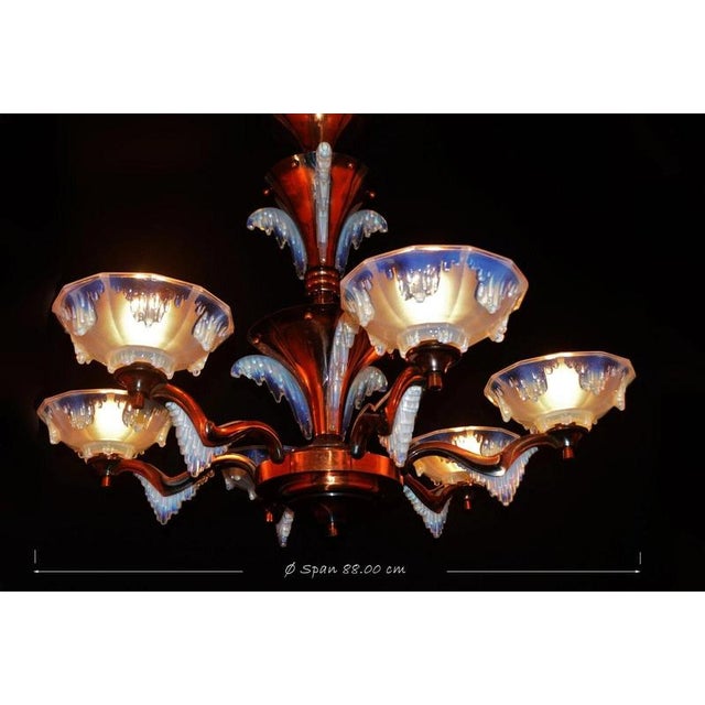 A spectacular and highly decorative French Art Deco six-light chandelier dating to circa 1930, featuring an architectural...