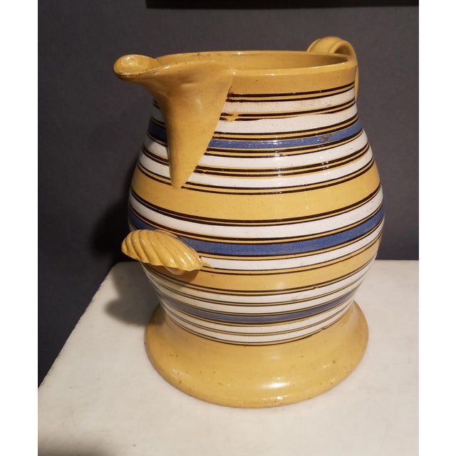 Large Mocha Yellow Ware Jug with Blue, White and Brown Slip Bands and Shell Grip Circa 1830–1840 Staffordshire, England...