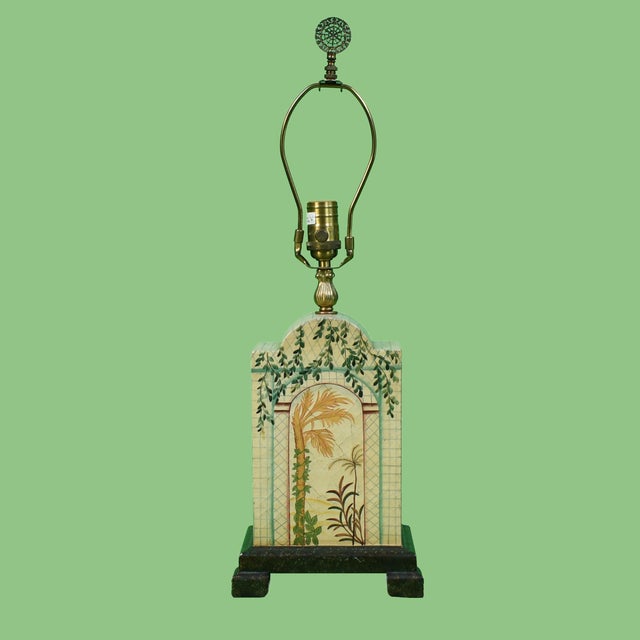 Add artisanal charm and warm light to any room with this delightful hand-painted table lamp. Each brushstroke brings a...