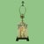 Add artisanal charm and warm light to any room with this delightful hand-painted table lamp. Each brushstroke brings a...