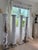 Striking set of four large solid wood architectural columns with beautifully aged white painted finish and authentic...