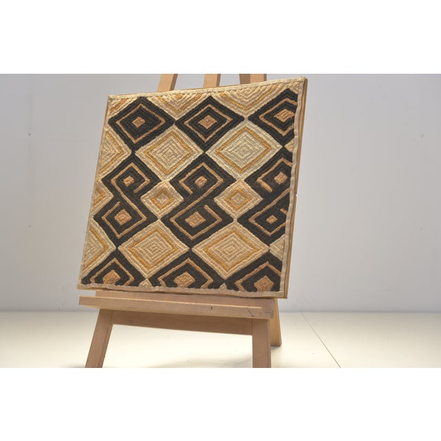 Shoowa Kuba The image shows a Kuba cloth (also called Kuba Cloth) from the Democratic Republic of Congo. More precisely,...