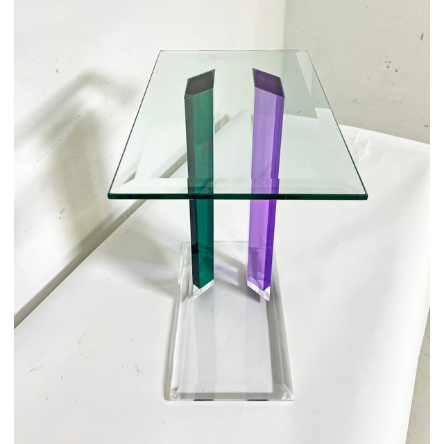 Postmodern glass and acrylic side table in the manner of Shlomi Haziza, c. 1990s. The top is beveled glass. The colored...