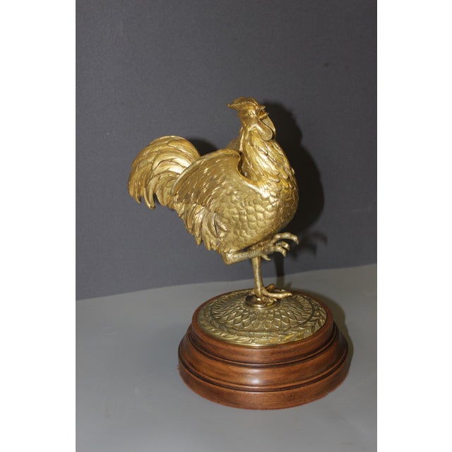 Gilt bronze rooster on a turned wooden base, late 19th century, in very good condition.