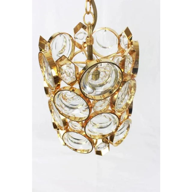 Petite brass and glass pendant by palwa (palme and walter), germany, manufactured in the 1970s. It’s composed of oval...