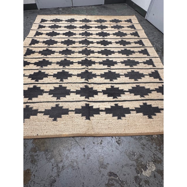Design Plus Gallery presents the 8ft 4in × 9ft 12in Bowen Jute & Wool Flatweave Rug from Rejuvenation. This flatweave rug...
