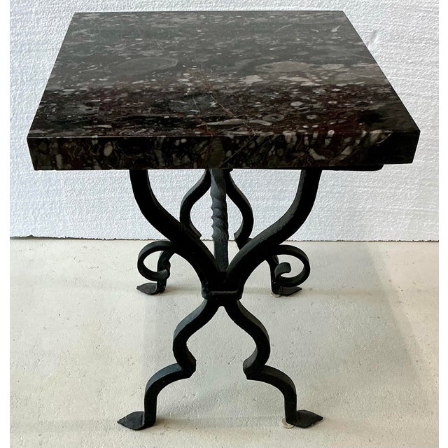 Beautiful antique hand made wrought iron table. 1 5/8” thick marble top. Very heavy.