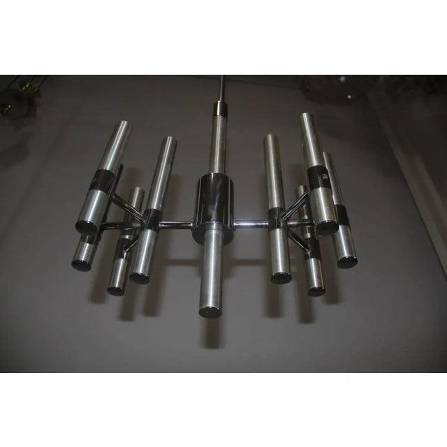 This minimalist chandelier takes 8 bulbs. Up to 250V (Europe/UK Standard).The wiring of this item may be original and...