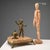 Marble inkwell supported by three bronze feet in the shape of a beast. The base features a figure of a boy and a gilded...