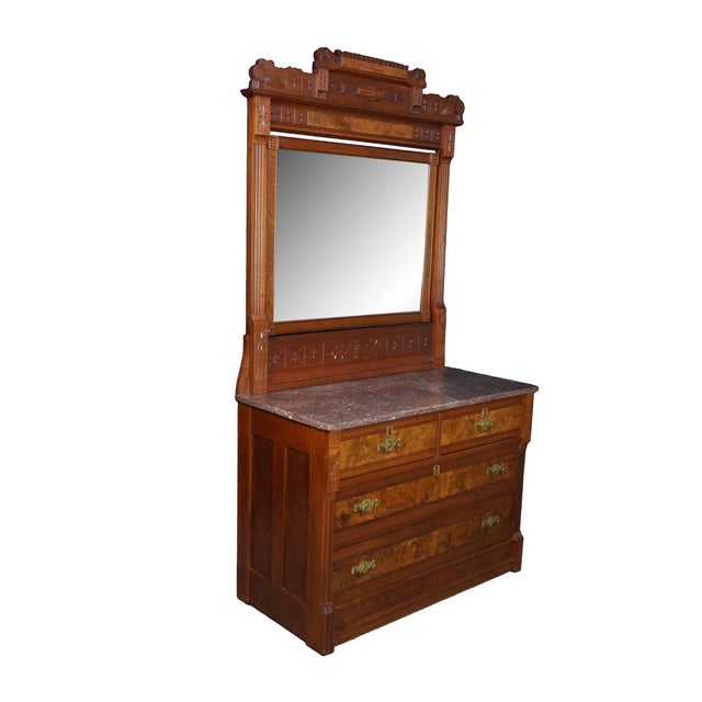 Exceptional antique Victorian dresser, circa 1880s. Showcasing stunning walnut burl veneers. The piece is crowned by a...