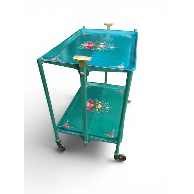 An original folding side table from the mid-century modern period, most likely made in Western Europe in the 1960s–70s. A...