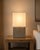 Modern square cube design table lamp with lightweight concrete resin base and white linen shade. Each is slightly unique...