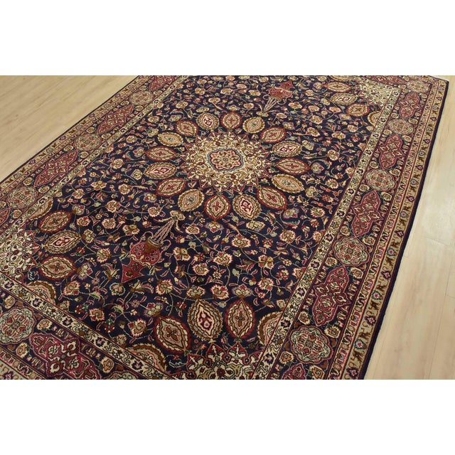 An authentic vintage traditional Tabriz rug hand-knotted with fine wool and natural dyes. This rug features a central...