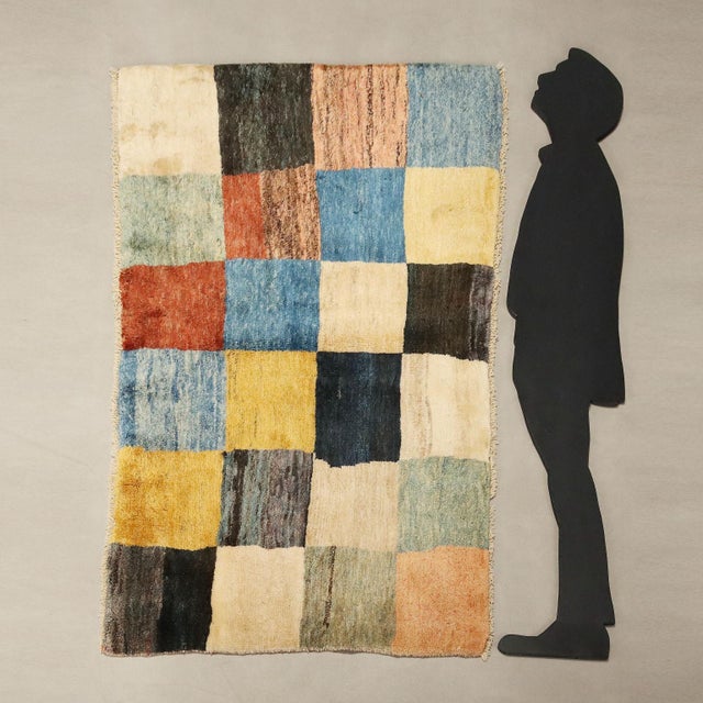 Gabbeh rug in wool with a checkered pattern, large knot, hand-made. This piece is attributed to the mentioned...