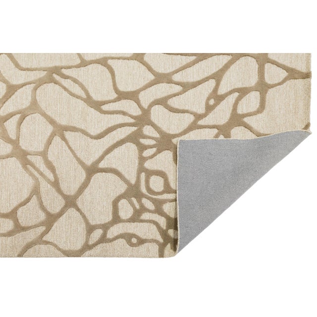 Bring a touch of nature-inspired sophistication to your home with this premium hand-tufted wool rug. Featuring a striking...