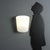 1980s wall lamp featuring an elegant opaline glass diffuser that provides a soft and even light. The metal fixture,...