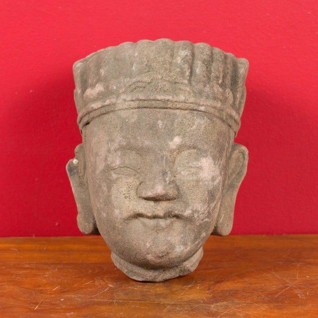 A Chinese Qing dynasty period carved head sculpture from the 19th century, with headdress. Carved in China during the Qing...