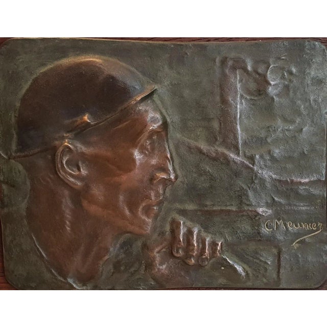 In the dark twists and turns of a coal mine, stands a man with a face marked by effort and suffering. His emaciated...