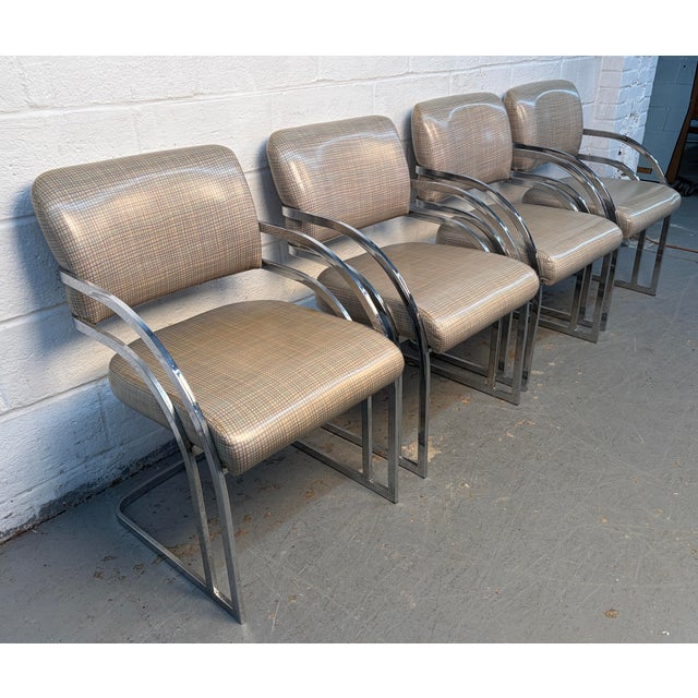 Enhance your dining space with this set of four upholstered dining chairs by Contemporary Shells Inc., beautifully...