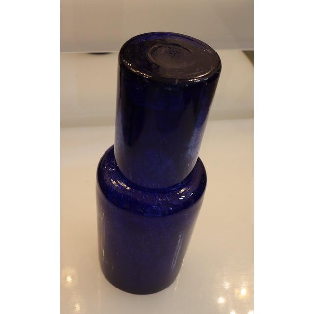 A beautiful set of a water bottle and glass in Murano glass. The hand-blown glass is of the precious millebolle type in a...