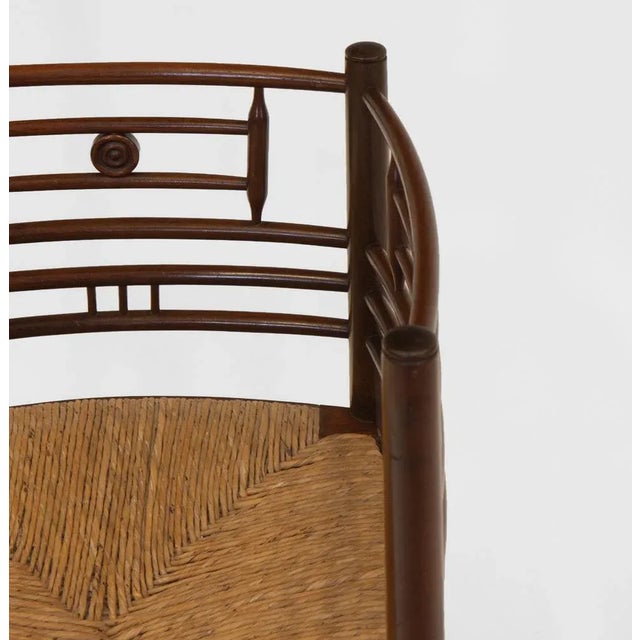 Aesthetic Movement Anglo Japanese manner mahogany and rush seated corner chair. Circa 1880. The Aesthetic Movement...