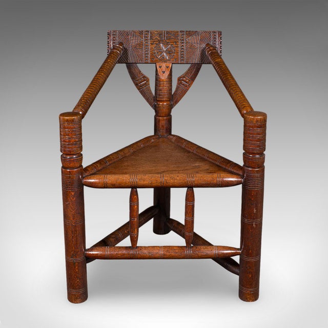 This is an antique turner's armchair. An English, oak Old Saxon elbow seat, dating to the late Victorian period, circa...