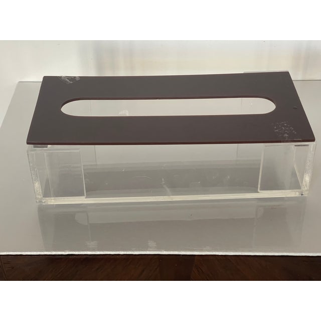 Mid century modern lucite tissue cover box in clear and brown lucite.