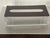 Mid century modern lucite tissue cover box in clear and brown lucite.