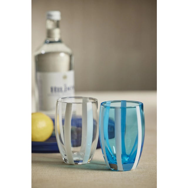 This lovely stemless glass is a stunning work of art. The shape is a classic tapered cylindrical shape, but the design of...