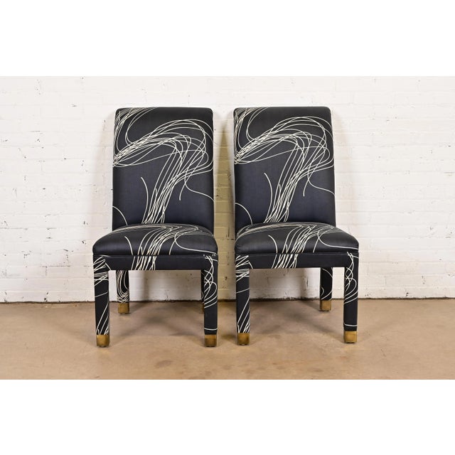 A gorgeous pair of Modern or Postmodern Parsons upholstered side chairs or dining chairs In the manner of Karl Springer...